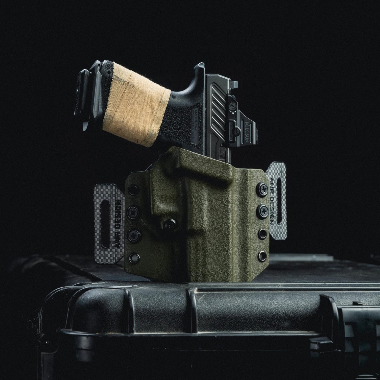 OWB holster in OD Green with Tegris Carbon Fiber Belt Loops.